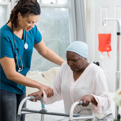 Nurse caregiver helping Infusion Services patient